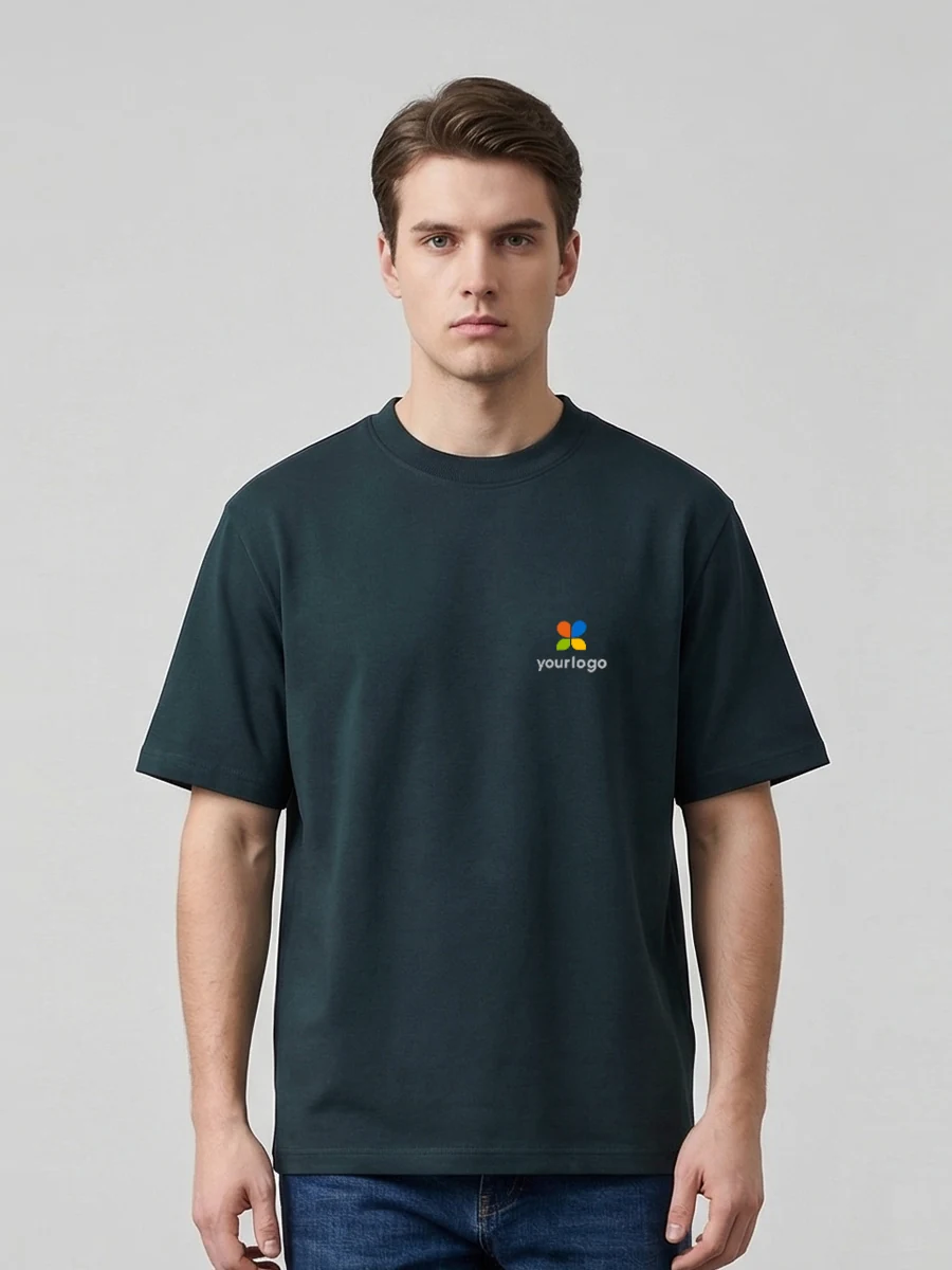Minimalist dark green tech fabric T-shirt featuring a rainbow logo on the chest, designed for daily commute, running, and fitness. The man wears it with a black counterpart, showcasing modern, sleek style. Clean lines and subtle branding reflect a minimalist aesthetic, blending functionality and contemporary design in a vibrant yet understated look.