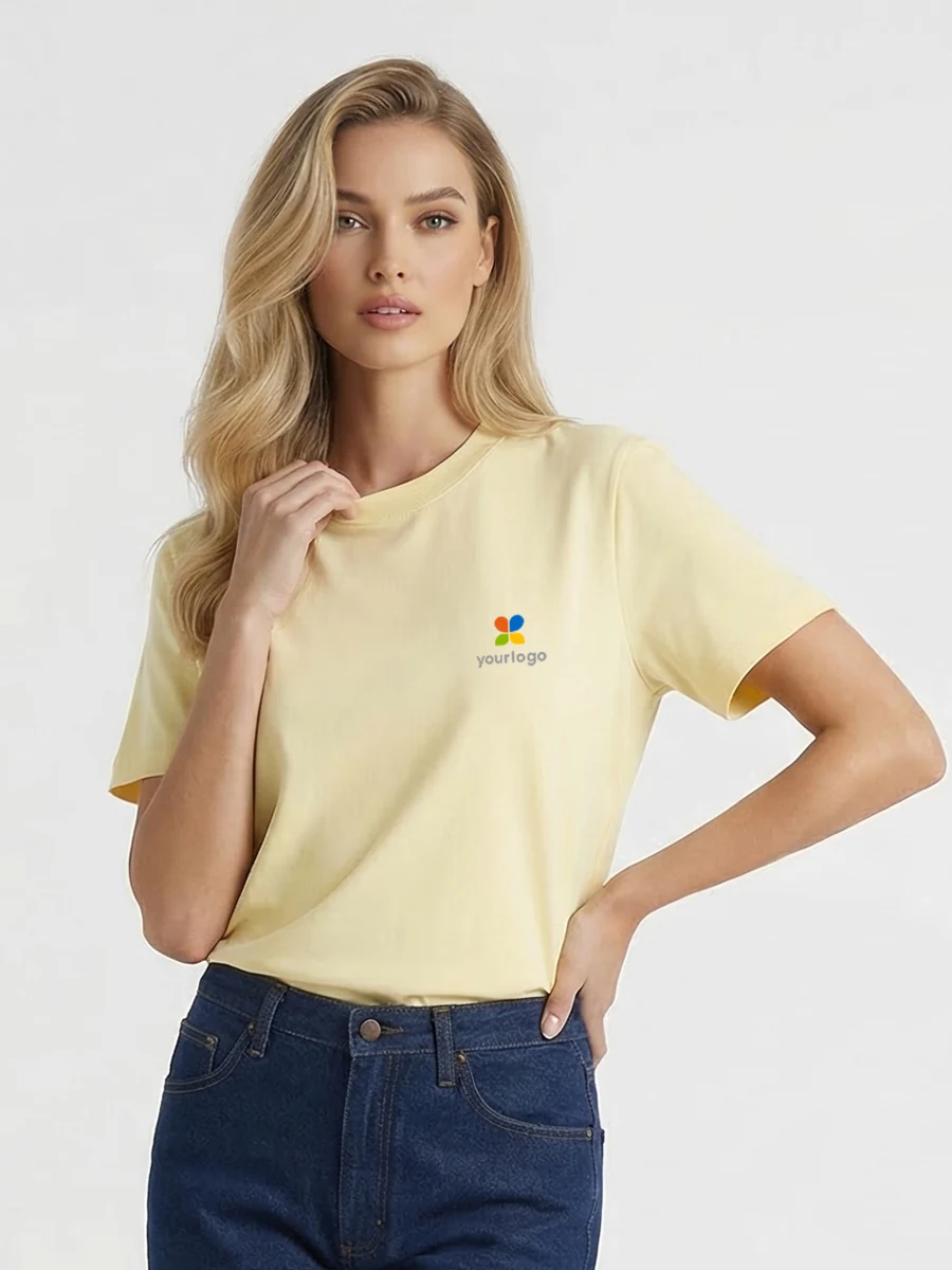 Woman wears a yellow quick-dry honeycomb T-shirt with a custom logo, ideal for daily commute. The 240g breathable fabric ensures instant drying, combining comfort and style. Styled in jeans and a short-sleeved top, she embodies modern  school elegance with vibrant yellow accents.